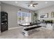 Farmhouse-style dining area with a wooden table, bench, and built-in shelving at 8308 W Avenida Del Sol --, Peoria, AZ 85383