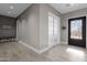 Bright entryway with tile flooring, a bench, and a decorative door at 8308 W Avenida Del Sol --, Peoria, AZ 85383