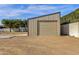 Detached garage with roll-up door and solar panels at 8308 W Avenida Del Sol --, Peoria, AZ 85383