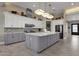 Modern kitchen with gray cabinets and large island at 8308 W Avenida Del Sol --, Peoria, AZ 85383