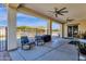 Relaxing patio with rocking chairs, ceiling fans and pool views at 8308 W Avenida Del Sol --, Peoria, AZ 85383