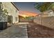 Backyard with concrete patio and gravel at sunset at 8851 E Pampa Ave, Mesa, AZ 85212