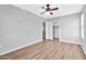 Bright bedroom with ceiling fan and wood-look flooring at 8851 E Pampa Ave, Mesa, AZ 85212