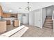 Kitchen and dining area with tile floors and staircase at 8851 E Pampa Ave, Mesa, AZ 85212