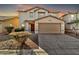 Two-story house with a two-car garage and landscaping at 8851 E Pampa Ave, Mesa, AZ 85212