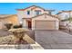 Two-story house with attached garage and landscaped front yard at 8851 E Pampa Ave, Mesa, AZ 85212