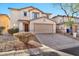 Front view of two-story house with attached garage at 8851 E Pampa Ave, Mesa, AZ 85212