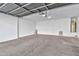 Clean and spacious garage with overhead door and ample storage space at 8851 E Pampa Ave, Mesa, AZ 85212