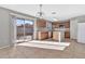 Kitchen with oak cabinets, island, and sliding door to patio at 8851 E Pampa Ave, Mesa, AZ 85212