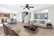 Living room with staged furniture and ceiling fan at 8851 E Pampa Ave, Mesa, AZ 85212