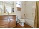 Clean bathroom with tub, shower, and wood vanity at 9323 E Arrowvale Dr, Sun Lakes, AZ 85248