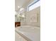 Bathroom with large soaking tub and marble vanity top at 9323 E Arrowvale Dr, Sun Lakes, AZ 85248