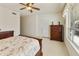 Bedroom with wooden sleigh bed, dresser, and exterior access at 9323 E Arrowvale Dr, Sun Lakes, AZ 85248