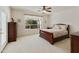 Bedroom with wooden sleigh bed, and ample closet space at 9323 E Arrowvale Dr, Sun Lakes, AZ 85248