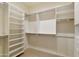 Large walk-in closet with double hanging rods and shelving at 9323 E Arrowvale Dr, Sun Lakes, AZ 85248