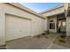 White two-car garage and covered entryway with walkway at 9323 E Arrowvale Dr, Sun Lakes, AZ 85248