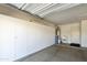 Garage with built-in cabinets and water softener at 9323 E Arrowvale Dr, Sun Lakes, AZ 85248