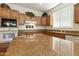 Kitchen features granite countertops and modern appliances at 9323 E Arrowvale Dr, Sun Lakes, AZ 85248