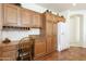 Kitchen with built-in desk and substantial wood cabinets at 9323 E Arrowvale Dr, Sun Lakes, AZ 85248