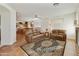 Relaxing living room with leather furniture and fireplace at 9323 E Arrowvale Dr, Sun Lakes, AZ 85248