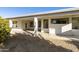 Covered patio with pebble stone flooring and citrus tree at 9323 E Arrowvale Dr, Sun Lakes, AZ 85248