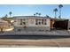 Single-wide manufactured home with carport and landscaped yard at 9501 E Broadway Rd # 178, Mesa, AZ 85208