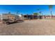 Gravel driveway with golf cart, and view of neighboring homes at 9501 E Broadway Rd # 178, Mesa, AZ 85208