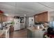 Functional kitchen with wood cabinets and a breakfast bar at 9501 E Broadway Rd # 178, Mesa, AZ 85208