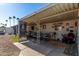 Covered patio with seating area, and desert landscaping at 9501 E Broadway Rd # 178, Mesa, AZ 85208