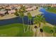 Aerial view of community, showcasing its location near a lake and golf course at 9509 E Arrowvale Dr, Sun Lakes, AZ 85248