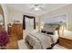 Bright bedroom with mountain mural and wooden furniture at 9509 E Arrowvale Dr, Sun Lakes, AZ 85248