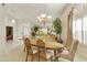 Formal dining room with a chandelier and wood table at 9509 E Arrowvale Dr, Sun Lakes, AZ 85248