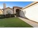 Front yard view of a single-story house with artificial turf at 9509 E Arrowvale Dr, Sun Lakes, AZ 85248