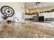 Granite countertops and a large island highlight this kitchen at 9509 E Arrowvale Dr, Sun Lakes, AZ 85248