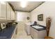 Bright laundry room with washer, dryer, and extra counter space at 9509 E Arrowvale Dr, Sun Lakes, AZ 85248