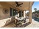 Covered patio with dining area and pool access at 9509 E Arrowvale Dr, Sun Lakes, AZ 85248