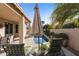 Relaxing pool area with patio furniture and lush plants at 9509 E Arrowvale Dr, Sun Lakes, AZ 85248