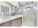 Modern bathroom with double vanity and walk-in shower at 1 Easy St # 12, Carefree, AZ 85377