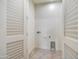 Laundry room with built-in shelving and cabinets at 1 Easy St # 12, Carefree, AZ 85377