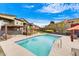 Community pool with lounge chairs and seating areas at 1 Easy St # 12, Carefree, AZ 85377