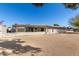 Sunny backyard with gravel and a view of the house at 10161 W Pineaire Dr, Sun City, AZ 85351