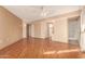 Bright bedroom with wood-look floors and ceiling fan at 10161 W Pineaire Dr, Sun City, AZ 85351