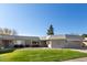 Front view of a single-story house with a grassy yard at 10161 W Pineaire Dr, Sun City, AZ 85351