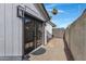 Backyard with paved pathway leading to a private door at 1104 N Oak Ct, Gilbert, AZ 85233