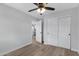 Bedroom with sliding closet doors and ceiling fan at 1104 N Oak Ct, Gilbert, AZ 85233