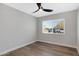 Well-lit bedroom with wood-look flooring and a window at 1104 N Oak Ct, Gilbert, AZ 85233