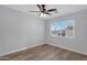 Bedroom with large window and ceiling fan at 1104 N Oak Ct, Gilbert, AZ 85233