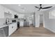 Modern kitchen with white cabinets, stainless steel appliances, and quartz countertops at 1104 N Oak Ct, Gilbert, AZ 85233