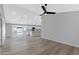 Spacious living room featuring hardwood floors and a ceiling fan at 1104 N Oak Ct, Gilbert, AZ 85233