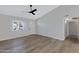 Bright living room with hardwood floors, a window, and ceiling fan at 1104 N Oak Ct, Gilbert, AZ 85233